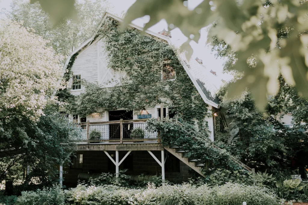 Exterior of Blue Dress Barn with blue siding and rustic barn doors in Benton Harbor, Michigan