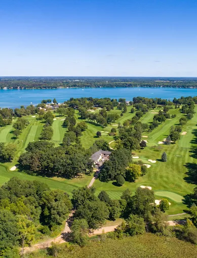 Reception at Gull Lake Country Club with elegant table settings and panoramic lake views.