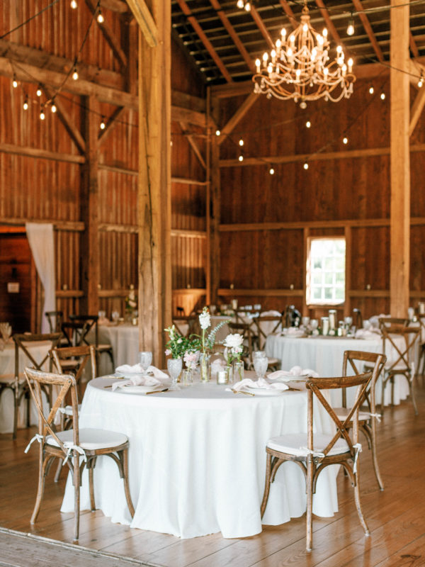 Barn reception with string lights at Hidden Vineyard Wedding Barn.