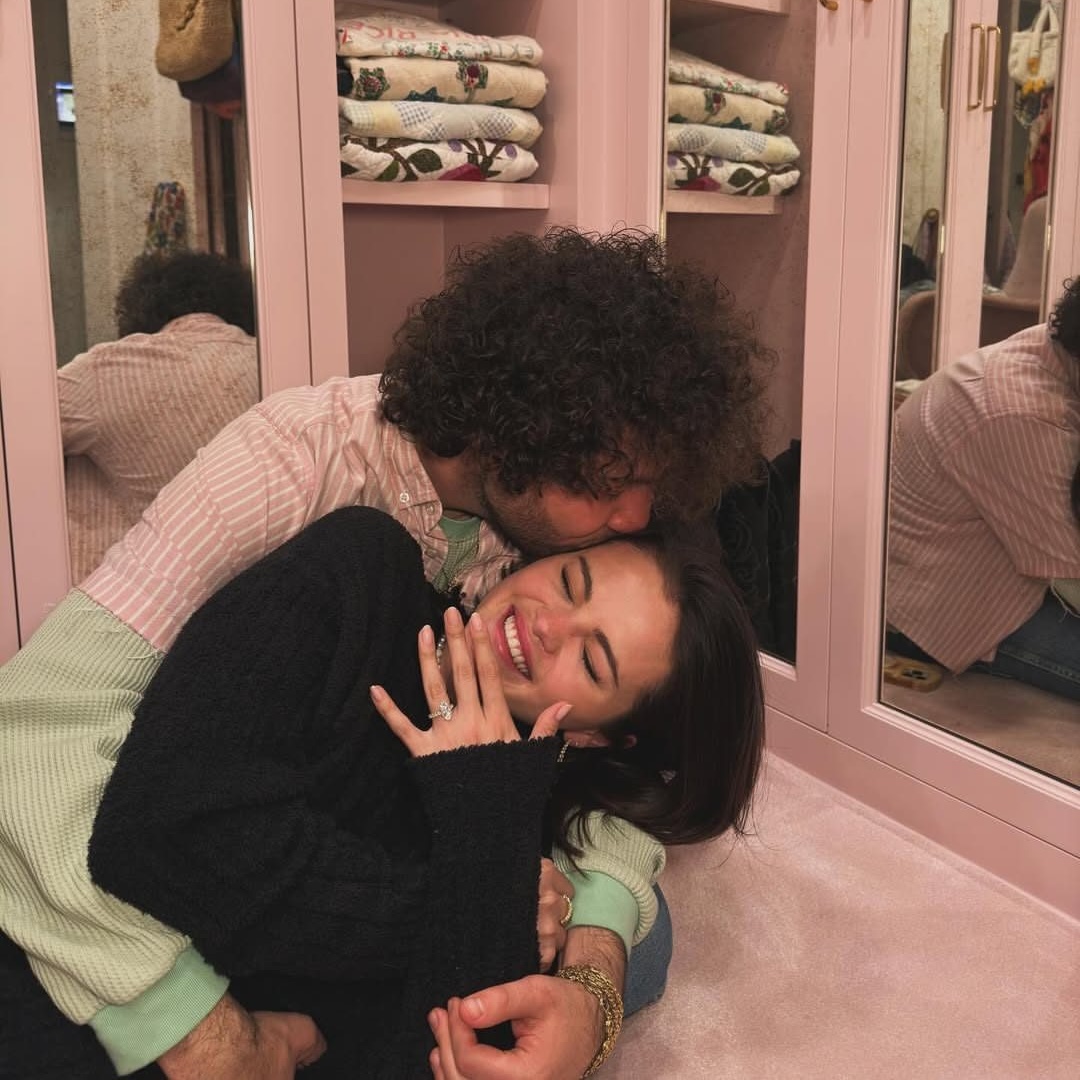 Engaged Michigan couple celebrating their engagement while planning a stress-free wedding in the new year